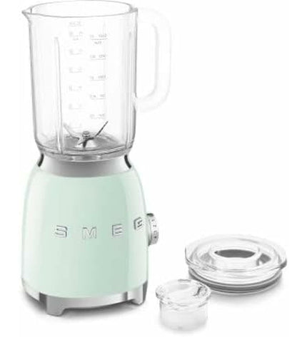 Smeg BLF03PGEU 800W small electric kitchen blender with 1.5L capacity, white and pink design, on a kitchen countertop.