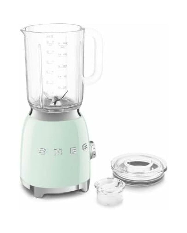 Smeg BLF03PGEU 800W small electric kitchen blender with 1.5L capacity, white and pink design, on a kitchen countertop.