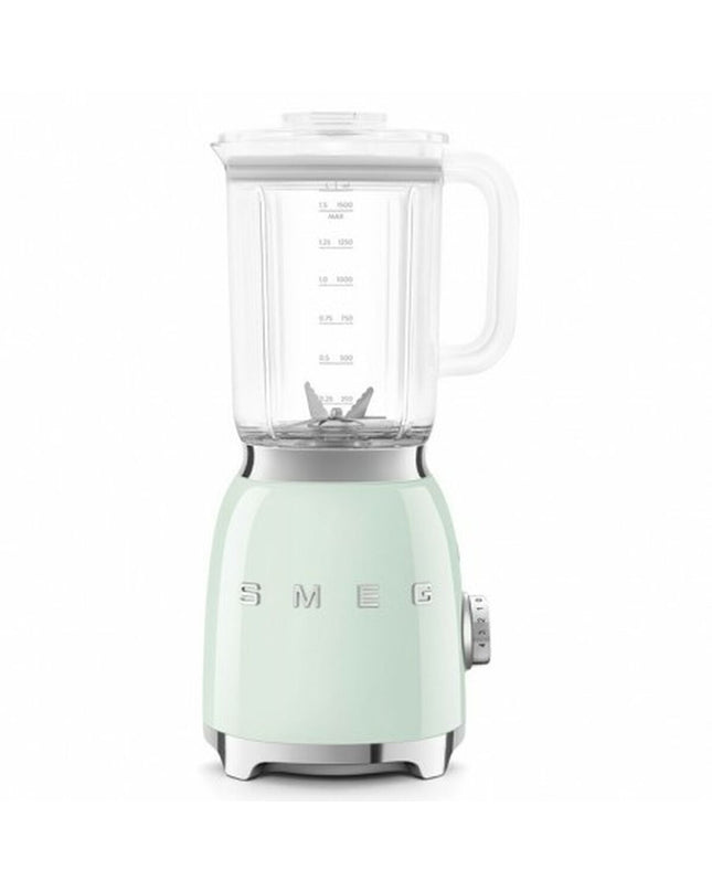 Smeg BLF03PGEU 800W compact kitchen mixer with 1.5L capacity, white and pink design, on a kitchen countertop
