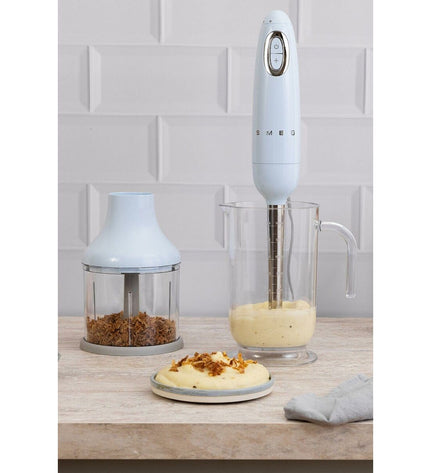 Blue Smeg HBF03PBEU multifunction handheld blender with accessories, 700W, ideal for home cooking and small electric appliances.