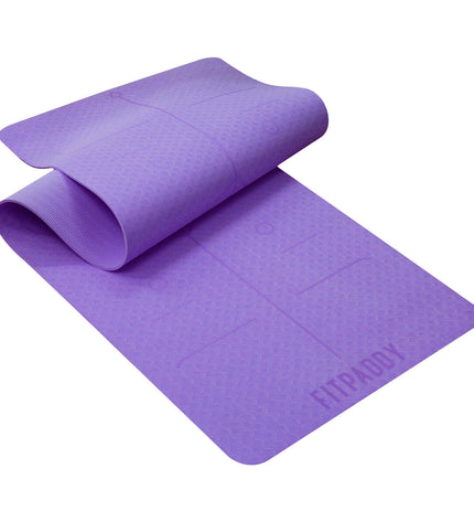 Purple Fitpaddy yoga mat for fitness and outdoor exercise, with textured surface for grip and comfort during workouts.
