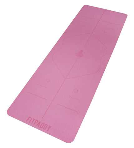 Pink Fitpaddy yoga mat for fitness and outdoor exercises, showcasing textured surface and vibrant color.