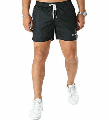 Black Champion men's swim trunks for sports and outdoor watersports, featuring a comfortable fit and sporty design.