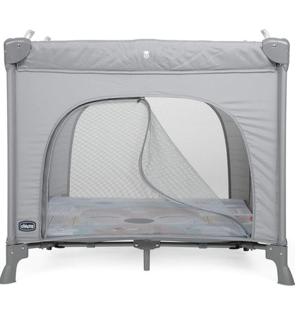 Chicco baby bedroom with gray play area or furniture, featuring soft bedding and cozy setup for a child's sleeping space.