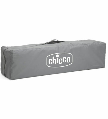 Chicco baby bedroom with a gray play area, featuring soft bedding and cozy furniture for a comfortable sleep space.