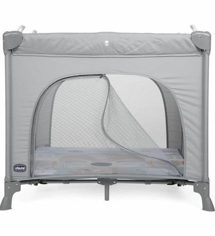 Chicco baby bedroom with a gray playpen and crib, soft bedding, and cozy nursery decor in a modern baby room setting.