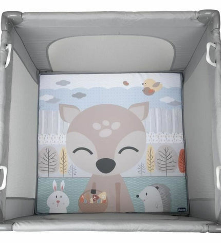 Chicco baby bedroom play area in gray with soft bedding and safety rails, designed for a cozy nursery space.