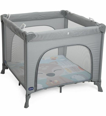 Chicco baby bedroom with gray play area, featuring soft bedding and cozy furniture for a comfortable nursery setting.