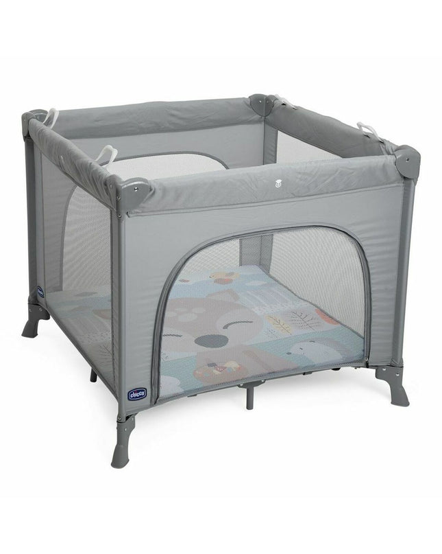 Chicco baby bedroom with gray play area, featuring soft bedding and cozy furniture for a comfortable nursery setting.