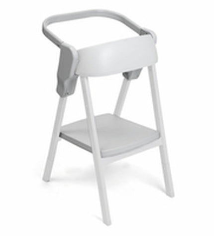 Child's Chicco baby chair in a bedroom setting, featuring a comfortable, child-friendly design with colorful accents.