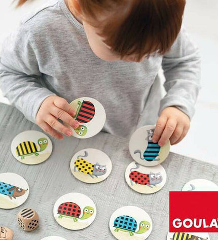 Goula Catch it educational game with colorful game pieces and catching tools, designed for kids' fun and learning.
