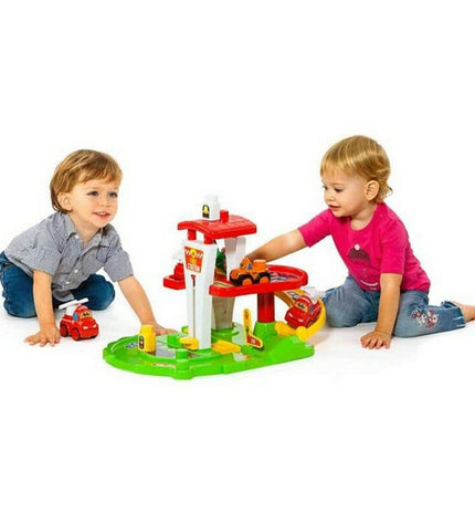 Moltó fire station playset with colorful toy buildings, fire trucks, and firefighter figures for imaginative play.
