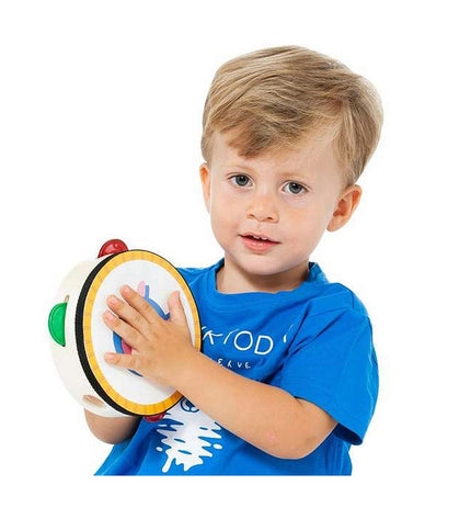 Baby playing with Moltó musical toy set, colorful musical instruments for young children, designed for early sensory development.