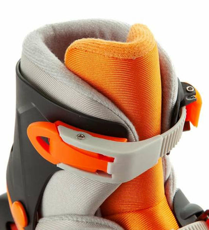 Orange Moltó adjustable inline skates for kids, size 35-38, with sturdy wheels and secure straps for outdoor play and sports.