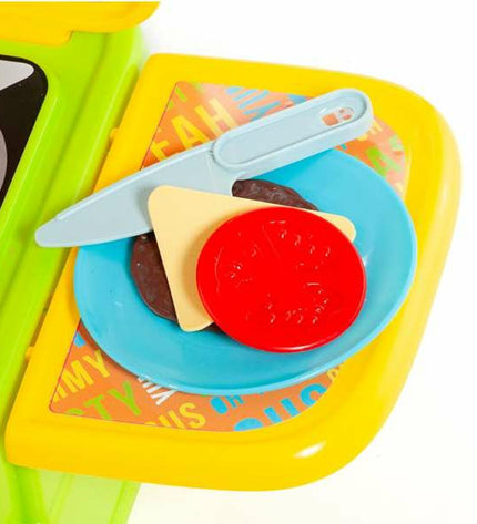 Toy kitchen set by Moltó, featuring realistic cookware, utensils, and accessories for imaginative play in a colorful play area.