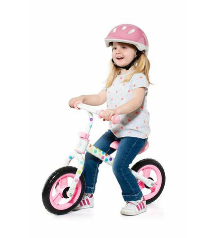 Pink kids' balance bike by Moltó, designed for young children, with a sturdy frame and no pedals for outdoor play.