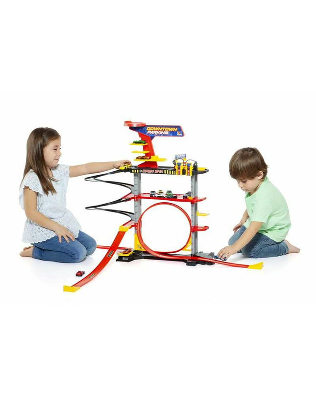 Moltó toy parking garage with colorful toy vehicles parked on multiple levels, detailed plastic construction for kids' play.