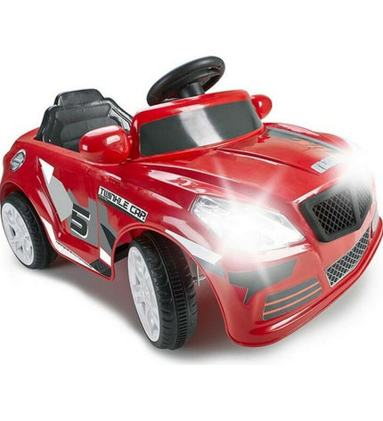 Feber electric toy car for kids, red and black, suitable for outdoor play, with realistic design and safety features.