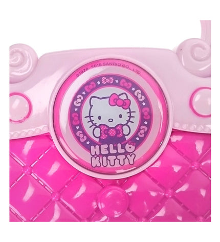 Hello Kitty karaoke handbag in pink, a playful electronic toy featuring Hello Kitty design and built-in microphone for singing fun.