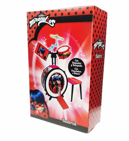 Lady Bug plastic drum toy for children, colorful toy percussion instrument with a ladybug design in a playful setting.