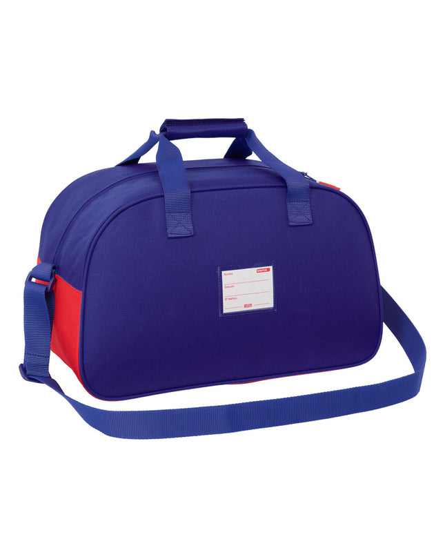 Atlético Madrid sports bag in blue, white, and red with dimensions 40x24x23 cm, designed for outdoor and sport activities.