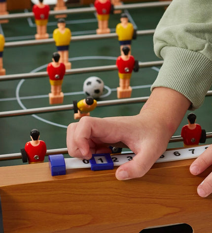 Colorbaby tabletop foosball game in blue and red, compact size 60x20x30 cm, for kids' toy and game fun.