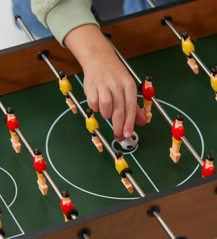 Colorbaby tabletop football game in vibrant colors, measuring 60x20x30 cm, designed for fun and gameplay.