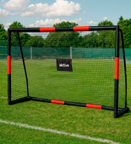 Black Aktive soccer goal for outdoor sports, featuring a sturdy metal frame and net for soccer practice and games.