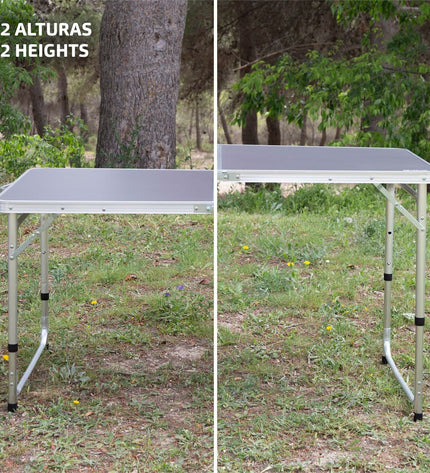 Aktive Tafel Aktive Grijs for camping and outdoor activities, featuring a durable, gray camping table in a natural outdoor setting.