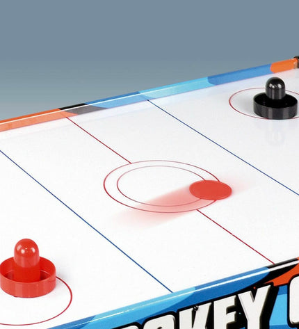 CB Games hockeytafel for kids, featuring a compact 122x61x75 cm design with colorful hockey sticks and pucks.