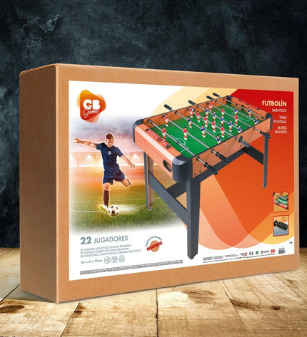 CB Games foosball table, 121 x 79 x 61 cm, with green playing surface, metal rods, and plastic players for tabletop gaming fun.