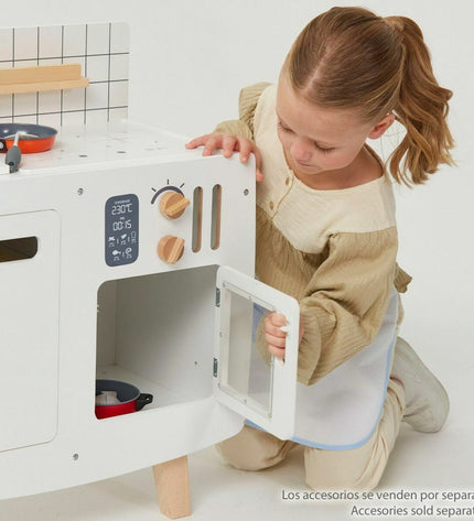 Teamson wooden toy kitchen set with stove, sink, and storage cabinets, designed for imaginative play, measuring 55x30x63 cm.
