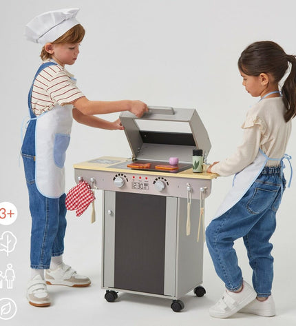 Teamson toy play kitchen with BBQ, measuring 60x66.5x30 cm, featuring realistic cooking accessories and colorful design.