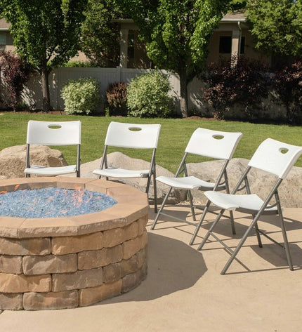Set of four Lifetime white folding camping chairs with 50x58x83 cm dimensions, ideal for outdoor, camping, and hiking activities.