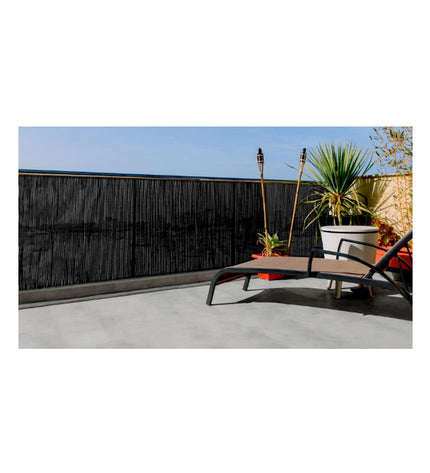 Black Nortene Fency wick garden fence, 1x3m outdoor decorative barrier with woven design in a garden setting.