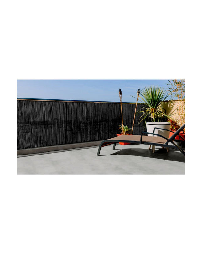 Black Nortene Fency wick garden fence, 1x3m outdoor decorative barrier with woven design in a garden setting.