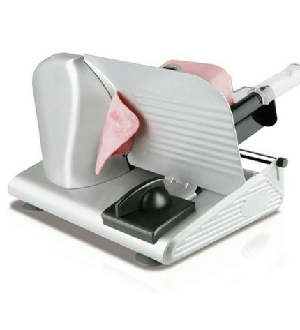 Taurus Cutmaster 150 W electric slicing machine with stainless steel blade and compact design for kitchen use.