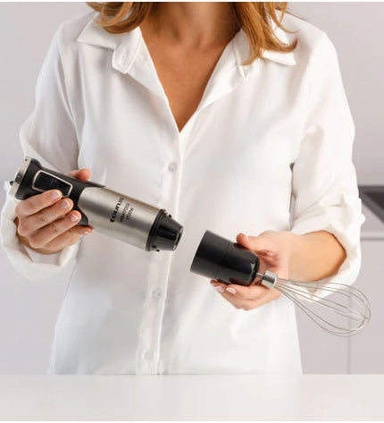 Taurus HBA1700X black handheld mixer with beaters and a power cord, suitable for home cooking and baking.