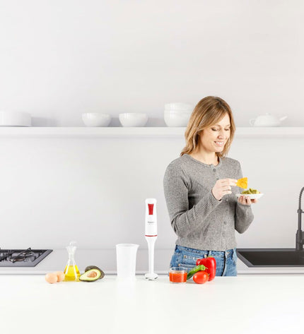 Taurus ROBOT750 handblender with 750W motor, in white, featuring a blending shaft and control buttons on the handle.