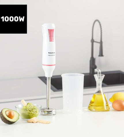 Taurus ROBOT 1000 X black hand blender with 1000W power, showing the blender's body and blending attachments on a kitchen countertop.
