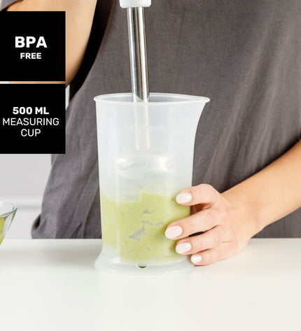 Taurus ROBOT 1000 X hand blender in black with 1000W power, shown with blending attachment on a kitchen countertop.