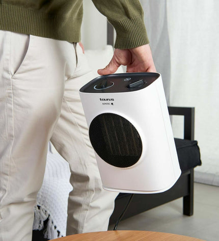 Taurus Tropicano 7CR white portable heater with 1500W power, designed for home heating and cooling, shown in the image.