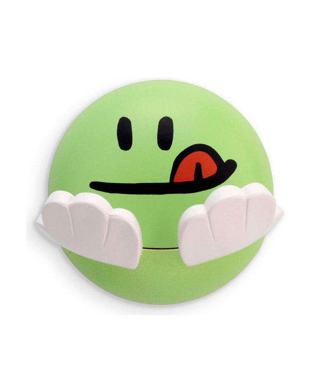 Inofix green towel hook for children, wall-mounted bathroom accessory for hanging hand towels, in a bathroom setting.