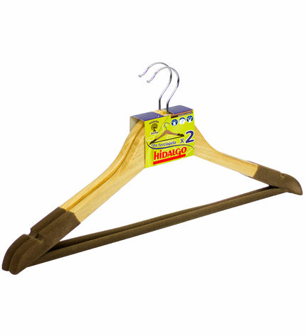 Pair of natural wood clothing hangers from Hidalgo, perfect for wardrobe organization, shown hanging in a closet.