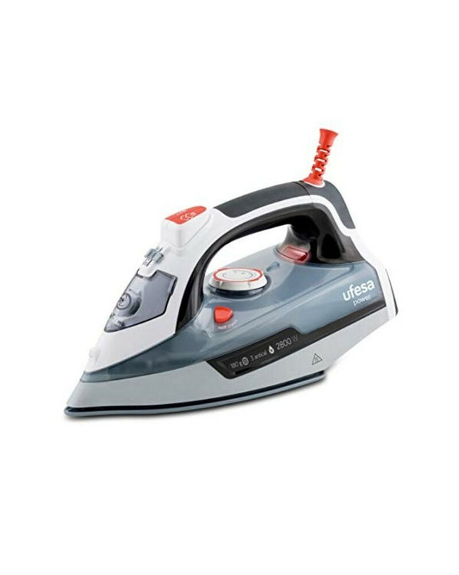 UFESA PV3285 steam iron with 0.33L water tank and 2800W power, shown in a home ironing setting