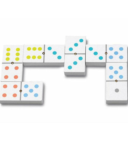 Cayro Domino set featuring rectangular white tiles with black dots, arranged in a line on a wooden surface.