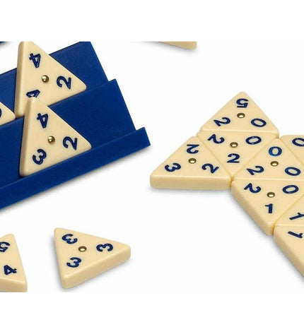Cayro Domino game set with rectangular tiles featuring black dots, arranged on a wooden surface for playing and entertainment.