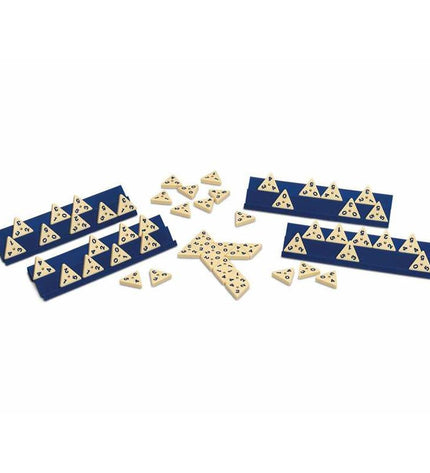 Cayro Domino game set with black and white domino tiles arranged on a wooden surface, ready for play.
