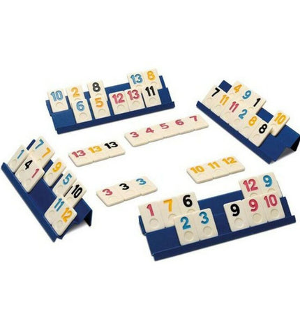Cayro Rummi Classic board game with colorful tiles on a wooden table, game box in the background, compact 27x27cm size