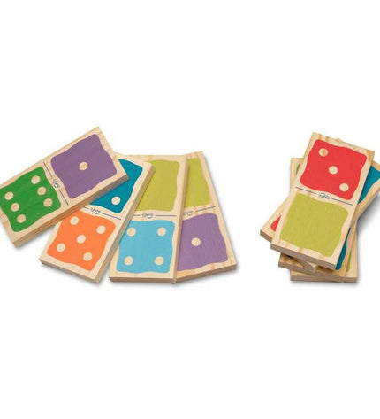 Cayro Domino set with black and white tiles, arranged in a line, used for playing domino games and family fun.